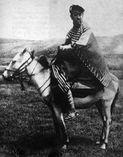 Portrait of Occultist Aleister Crowley Sitting on Donkey. Aleister Crowley is shown riding a donkey on the Deosai Plateau at the time of his first Himalayan Expedition.